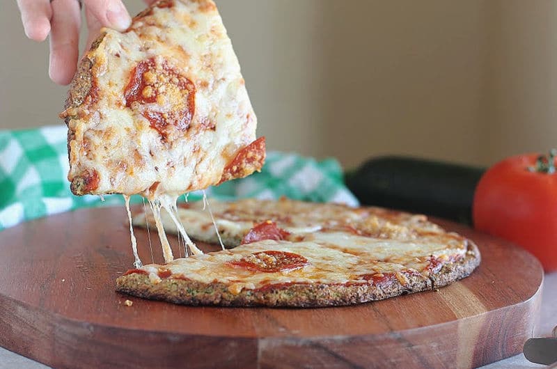 Cheese pull on a zucchini pizza crust.