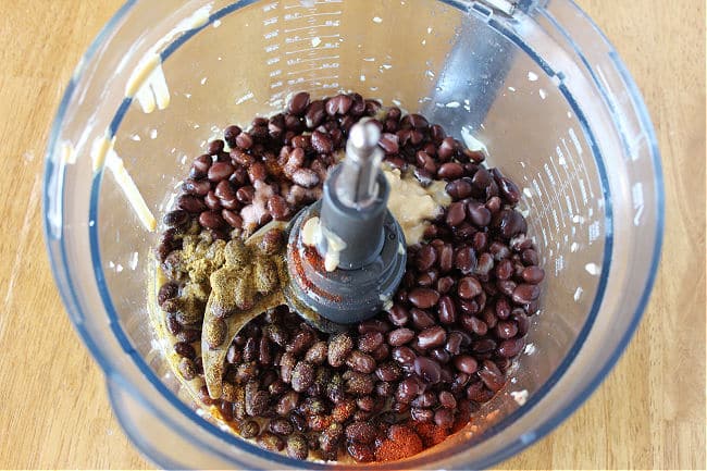 Black beans and spices in a food processor.