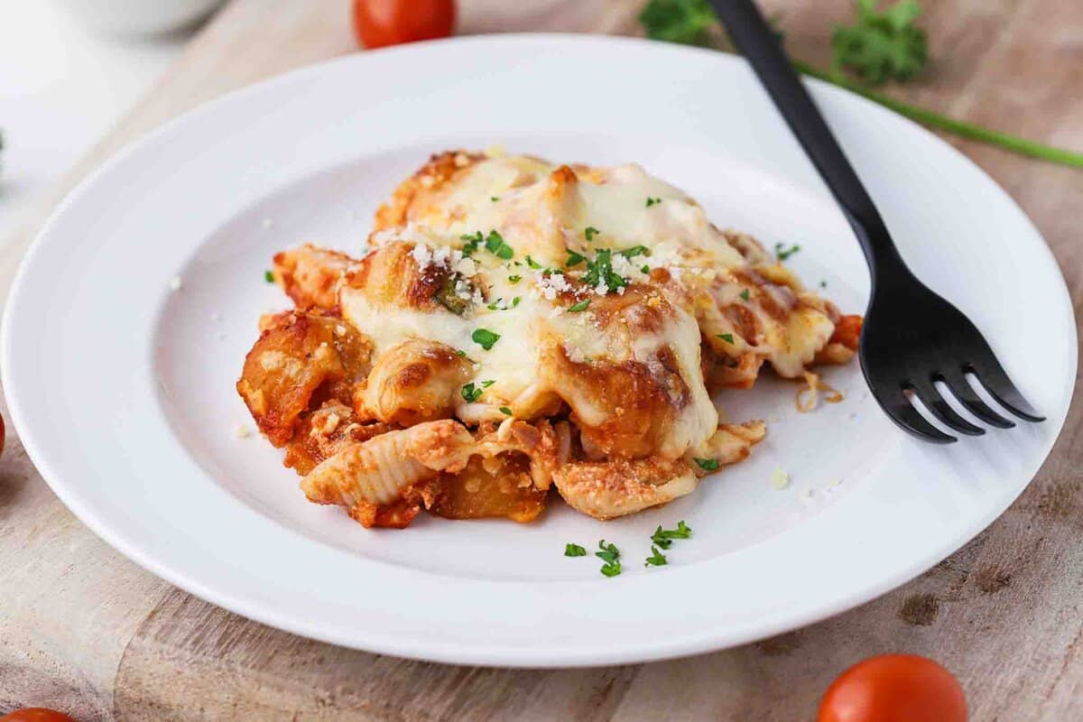 Spoonful of baked pasta on a plate.