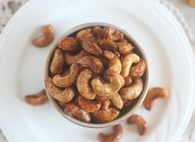 Top down view of a bowl of roasted cashews.