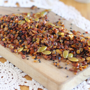 Granola spread on a wood board.