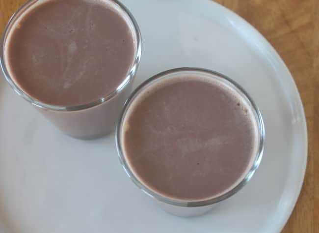 Chocolate pudding in a cup before being chilled.