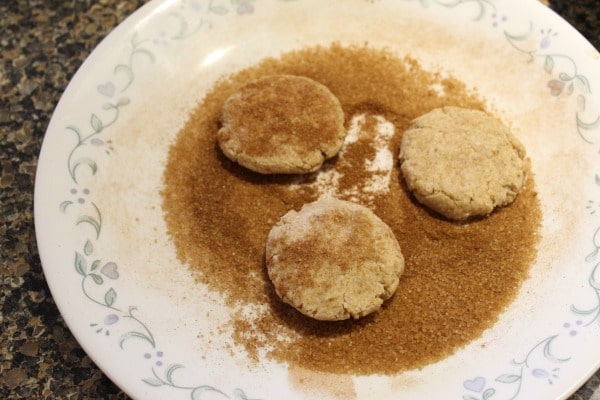 Snickerdoodles rolling in cinnamon sugar