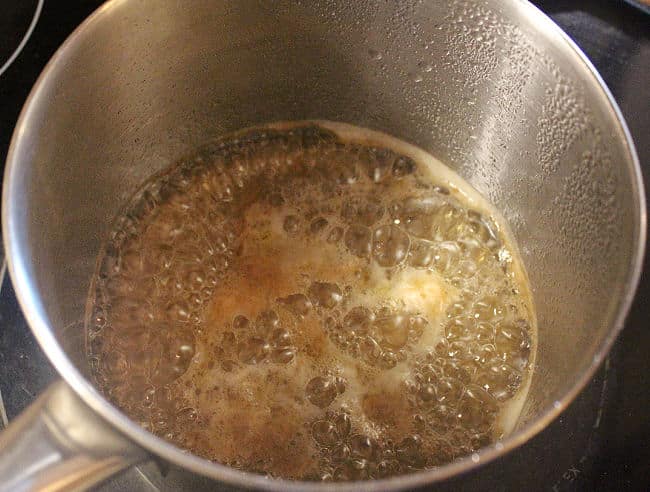 Syrup simmering in a steel pot.