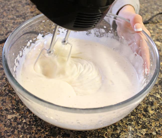Using a hand mixer to make marshmallows.