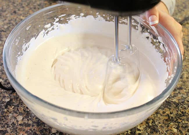 Whipping marshmallow fluff in a bowl.