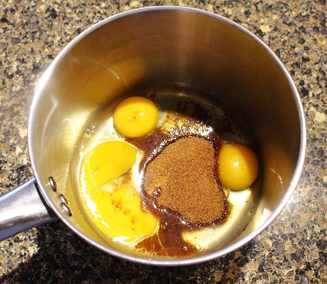 Eggs and sugar in a saucepan.