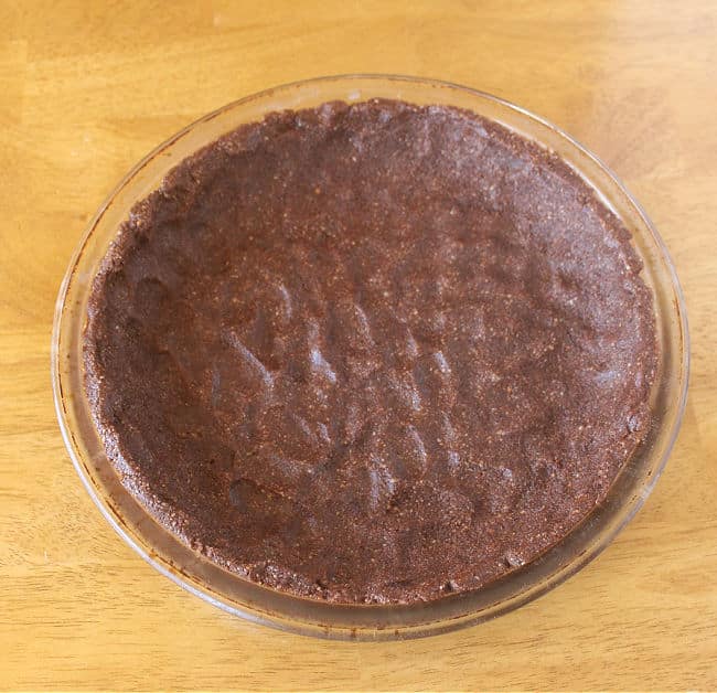 Unbaked chocolate pie crust pressed into a pie plate.