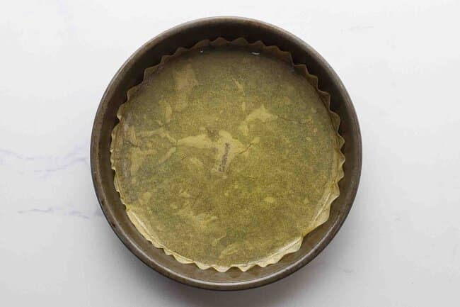 Oil-covered parchment paper in a cake pan.