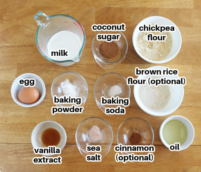 Various ingredients laid out on a table, including flour, egg, and milk.