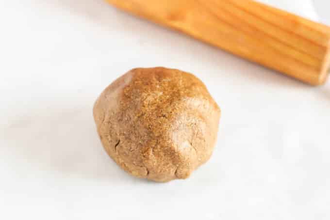 Ball of dough on a table.