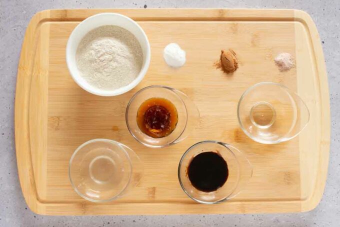 Various ingredients on a table, including flour and oil.