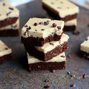 Raw cookies and cream bars in a stack of three.