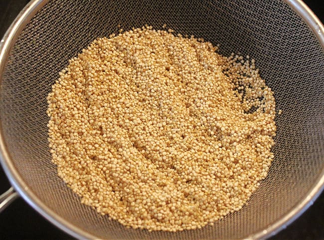 Rinsed quinoa in a sieve.