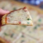 Coconut flour pizza crust with sauce and cheese