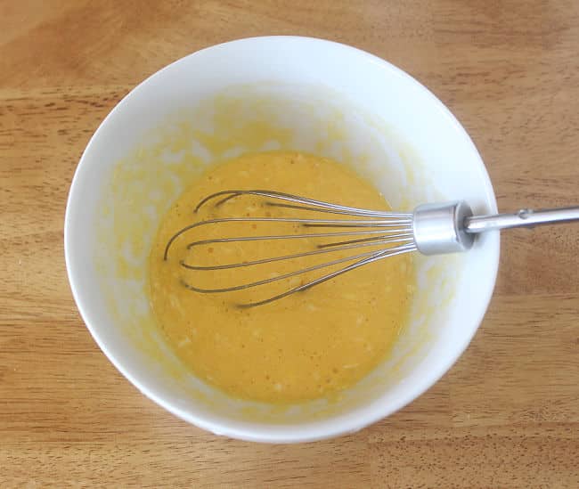 Whisking eggs in a bowl.