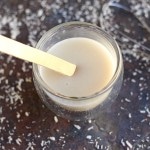 Condensed milk in a glass with a stick.