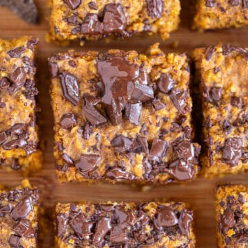 Squares of pumpkin bars with chocolate chips on top.