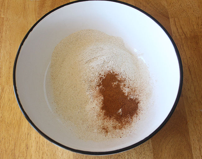 Flour and spices in a large white bowl.