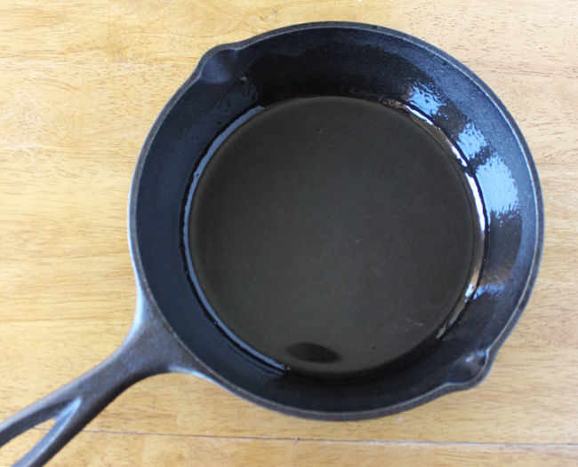 One cast iron pan on a table.