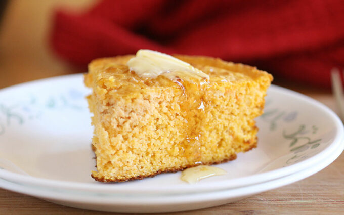 Cornbread with butter and honey on top.