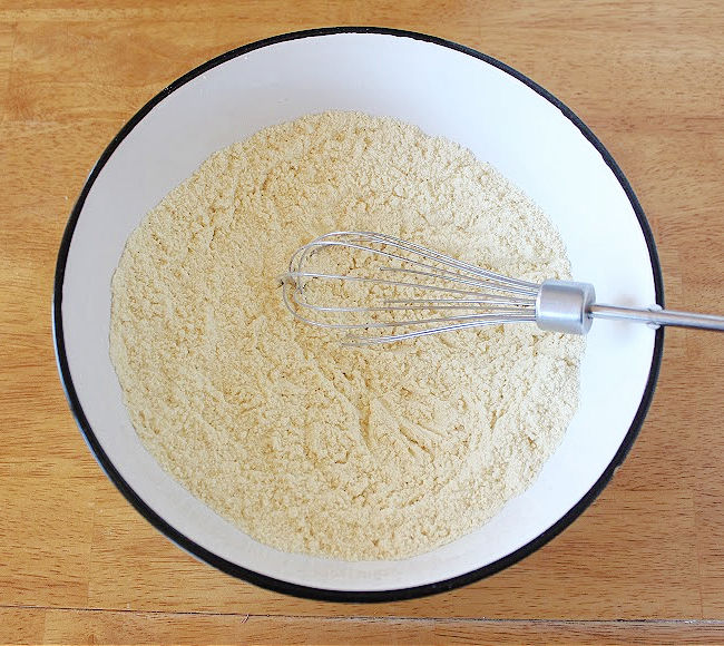 Millet flour in a large white bowl.