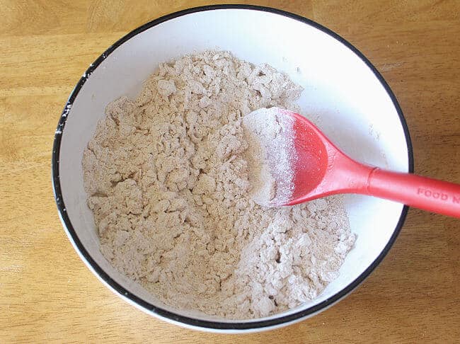Flour, salt, baking powder, and applesauce in a large white bowl.