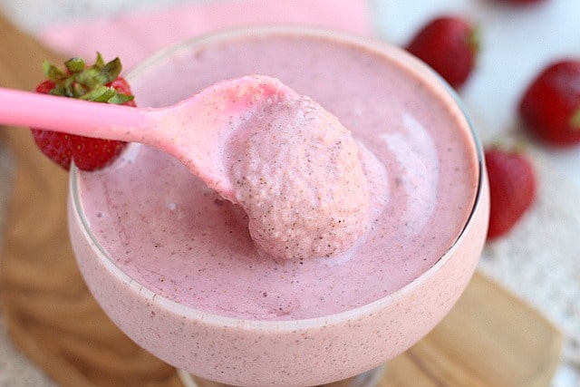 Thick strawbery chia shake in a glass.