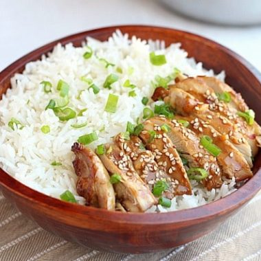 Teriyaki chicken and white rice in a brown bowl.