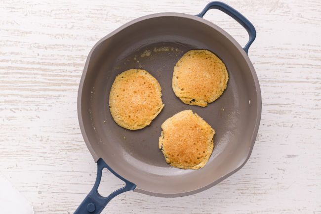 Frying three pancakes in a non-stick skillet.