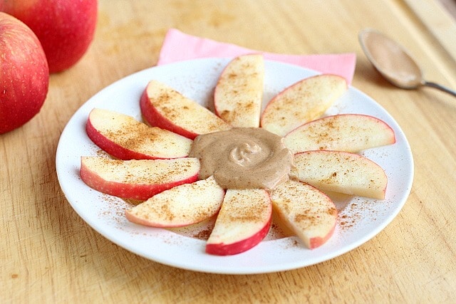 Peanut butter and apples on a plate