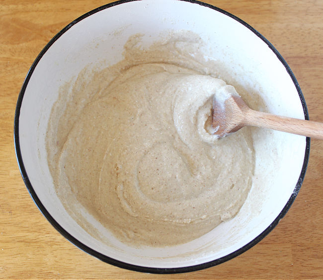 Mixing batter in a white bowl.