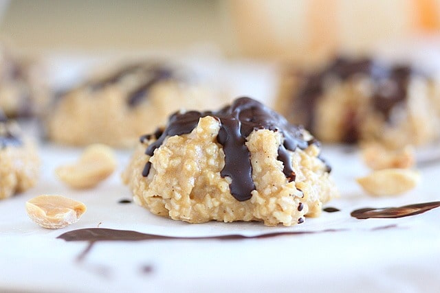 Peanut butter and coconut combined with chocolate on a paper.