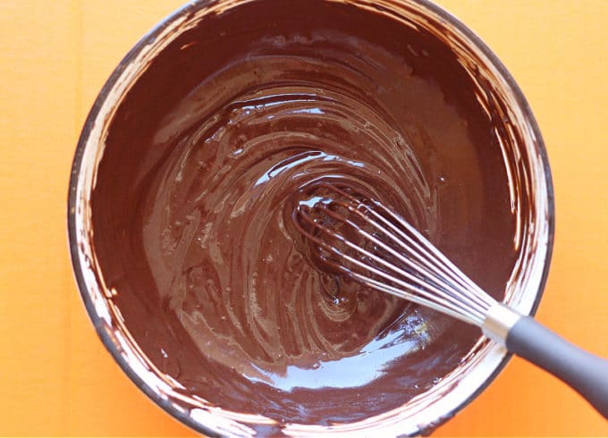 Chocolate sauce swirled in a bowl.