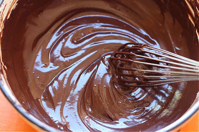 Healthy chocolate sauce being whisked in a bowl.