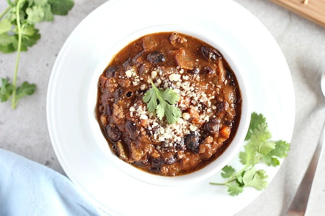 Vegetable-packed chili made with ground beef on the stove