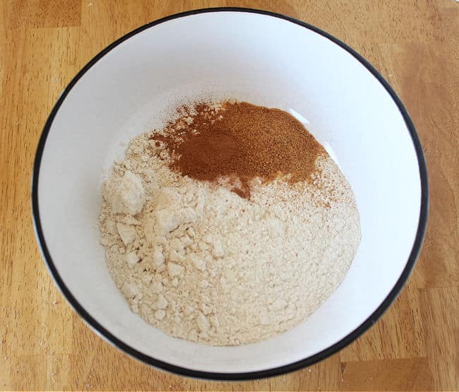 Flour and sugar in a large white bowl.