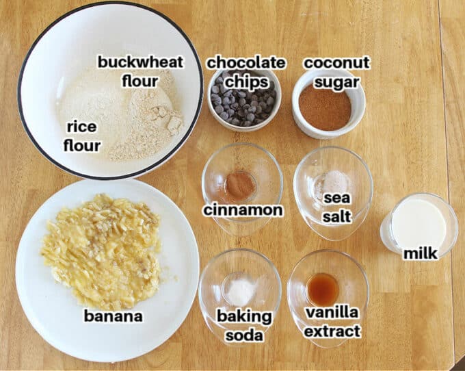 Ingredients laid out on a table, including mashed banana and flour.