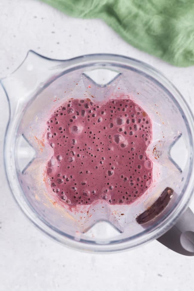 Blended berry smoothie in a blender.