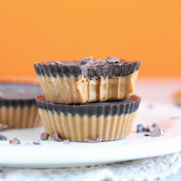 Stack of homemade peanut butter cups on a white plate.