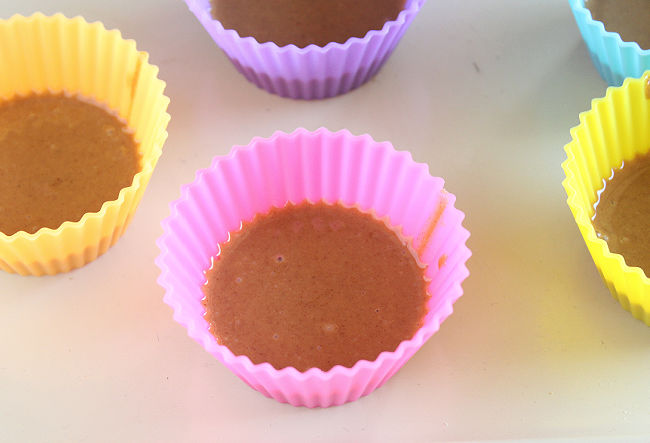 Peanut butter in a silicone muffin cup.