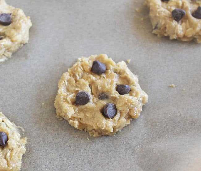 Pre-baked cookie on a baking sheet.