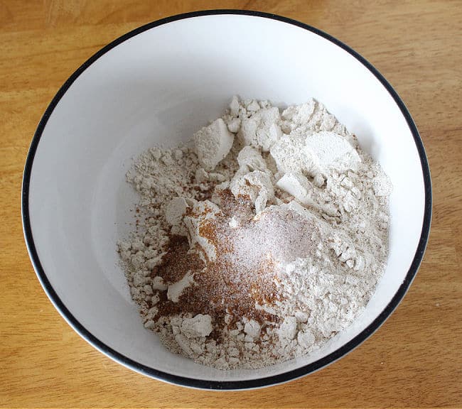 Flour, sugar, and salt in a large white bowl.