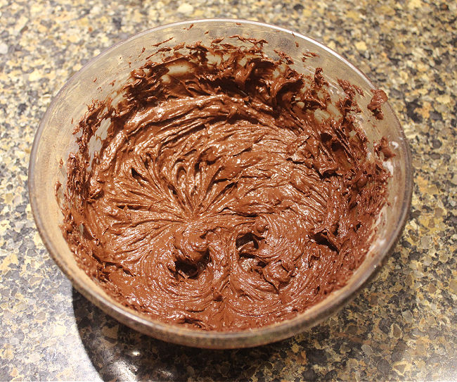 Chocolate batter in a glass bowl.