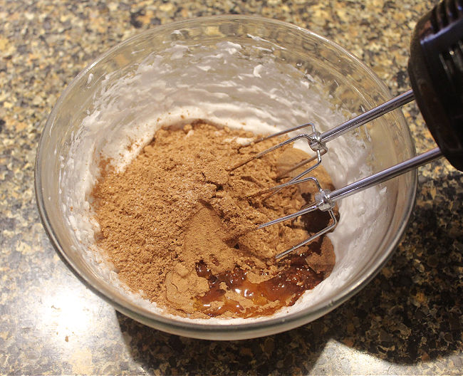 Oil, cocoa, and syrup in a glass bowl.