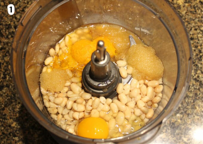 Vanilla cupcake ingredients in a food processor.