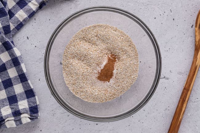 Oat bran, baking soda, salt, and cinnamon in a large bowl.