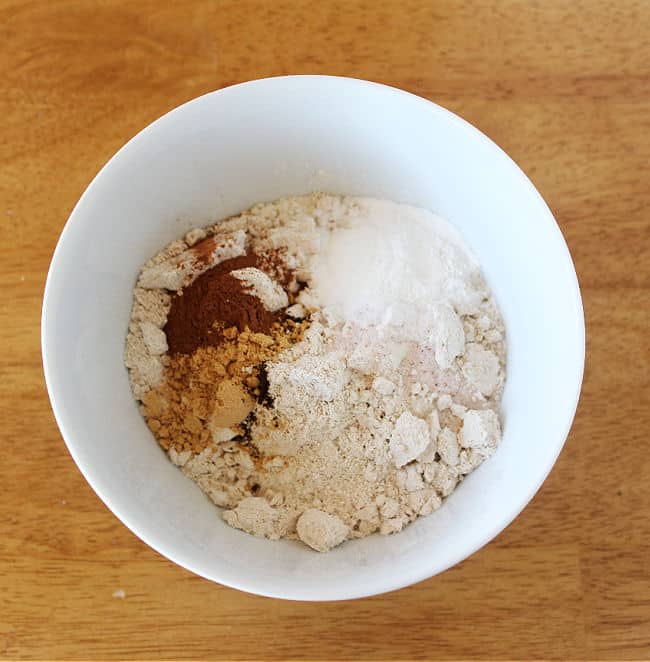Flour, baking powder, and sea salt in a white bowl.