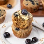 Stack of two blueberry oat bran muffins.