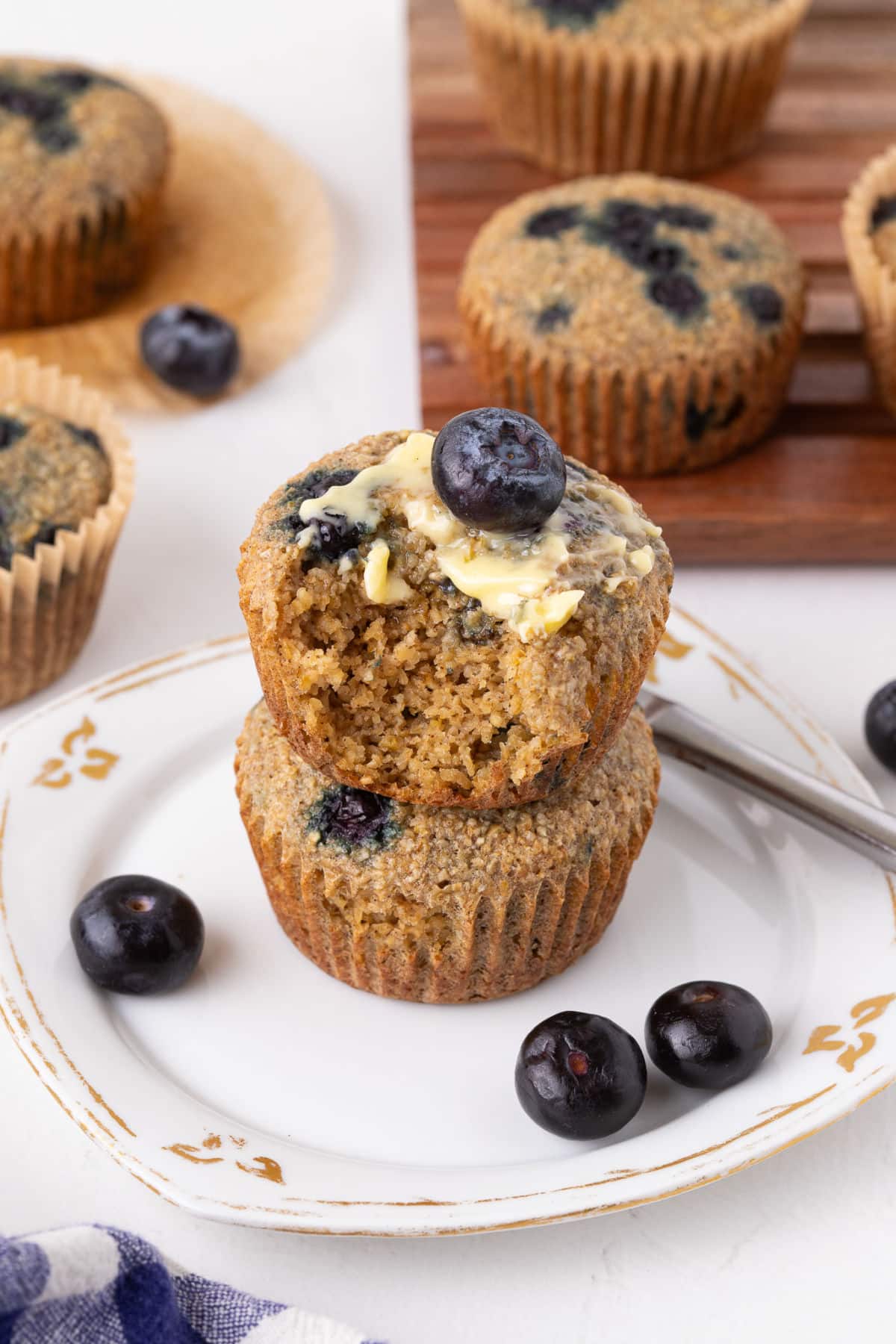 Stack of two blueberry oat bran muffins.